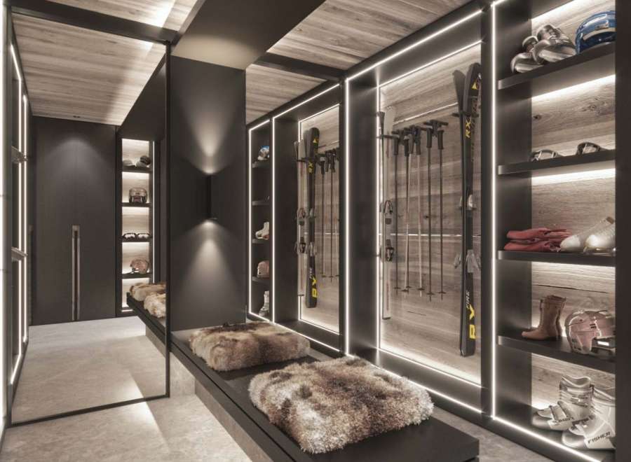 This luxurious ski room boasts ample storage for all your winter gear, including built-in shelving for skis, boots, and helmets.