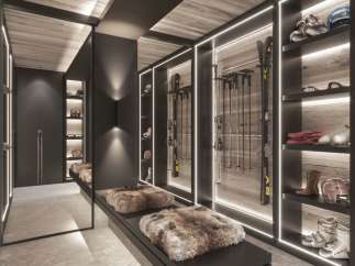 This luxurious ski room boasts ample storage for all your winter gear, including built-in shelving for skis, boots, and helmets.