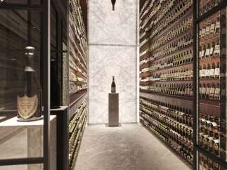 This luxurious property boasts a stunning, temperature-controlled wine cellar, showcasing an extensive collection of fine wines.