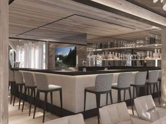 This luxurious chalet boasts a stunning bar area, complete with a sleek design and high-end finishes.