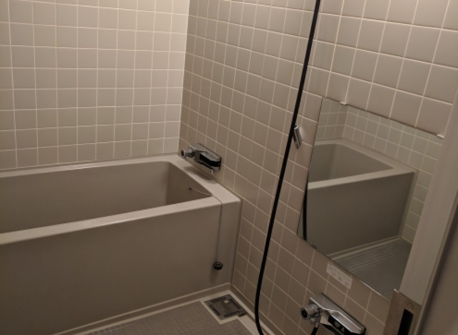 This bathroom features a sleek, modern design with a neutral color palette.