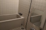 This bathroom features a sleek, modern design with a neutral color palette.