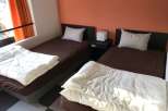 Cozy bedroom with two twin beds, perfect for a comfortable stay.