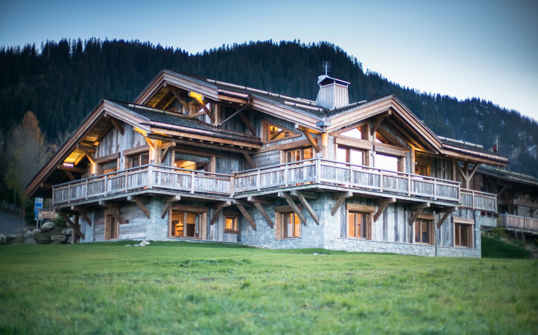 Luxury chalet nestled in the French Alps, boasting stunning mountain views and exquisite craftsmanship.