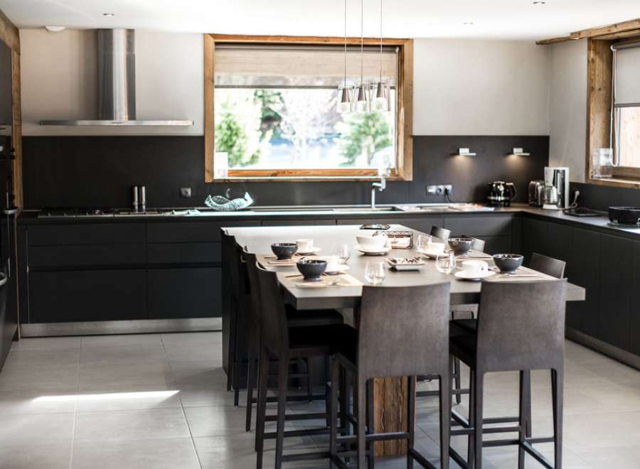 This stunning kitchen boasts a large island with seating for eight, perfect for entertaining.