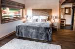 Luxurious chalet bedroom with stunning views.