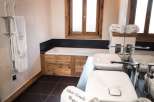 Luxurious bathroom with wooden features and a freestanding bathtub.