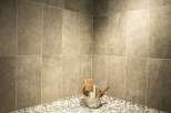 Relax and rejuvenate in our luxurious sauna, featuring a stunning mosaic tile design and comfortable seating.