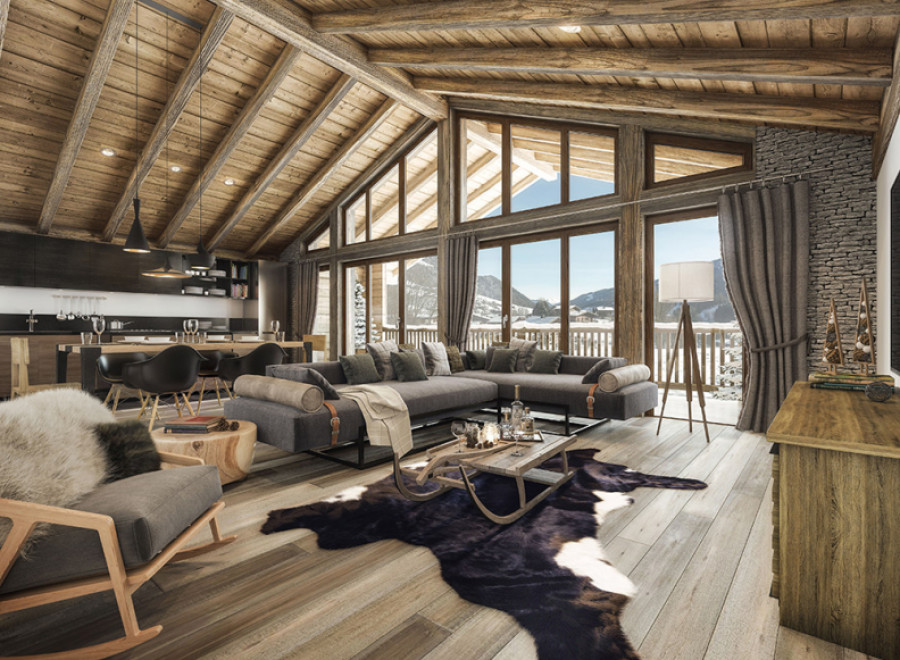 This stunning chalet boasts a spacious open-plan living area with exposed wooden beams, large windows offering breathtaking mountain views, and a cozy fireplace.