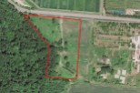 This secluded 5-acre property boasts a unique, irregular shape and is nestled within a serene forest setting.