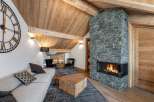 Cozy mountain chalet with a stunning stone fireplace as the centerpiece.