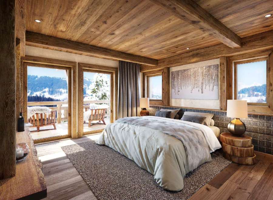 Luxury chalet bedroom with stunning mountain views.