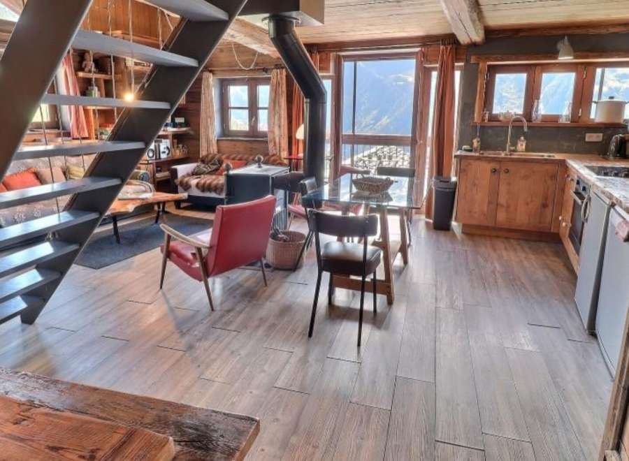 Mountain view chalet with open plan living and kitchen.