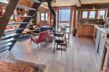 Mountain view chalet with open plan living and kitchen.