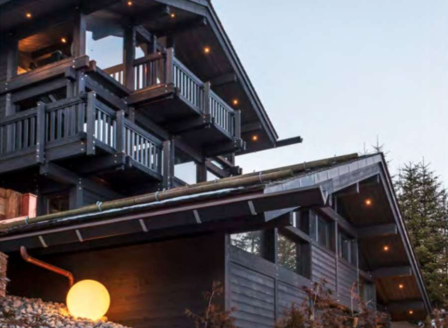 This stunning chalet boasts a unique architectural design, multiple balconies offering breathtaking views, and luxurious interior finishes.