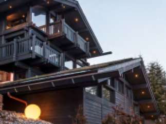 This stunning chalet boasts a unique architectural design, multiple balconies offering breathtaking views, and luxurious interior finishes.
