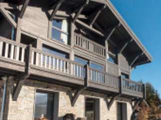 This stunning chalet boasts a unique blend of rustic charm and modern elegance.