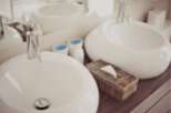 Indulge in our luxurious bathroom featuring sleek, modern sinks and premium fixtures.