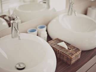 Indulge in our luxurious bathroom featuring sleek, modern sinks and premium fixtures.