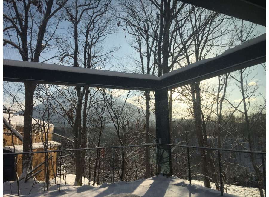 Stunning winter views from this modern home's deck.