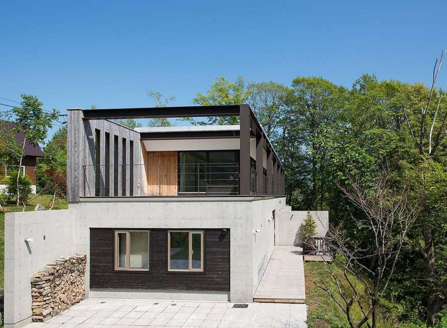 Stunning contemporary home nestled in a lush forest setting.