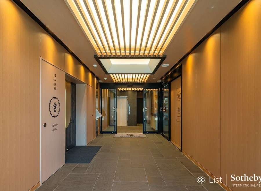 This stunning property boasts a sophisticated entrance with a sleek, modern design.