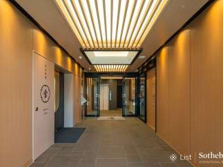 This stunning property boasts a sophisticated entrance with a sleek, modern design.