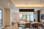 This stunning modern home boasts an open floor plan, seamlessly connecting the living and dining areas.