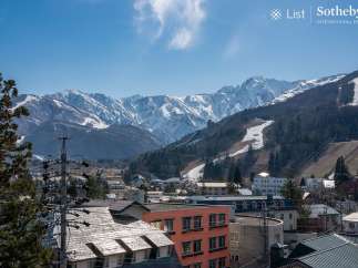 This stunning property boasts breathtaking views of the Japanese Alps, offering a serene escape in a vibrant mountain town.