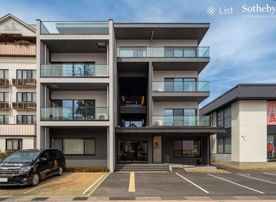 This stunning modern building boasts four floors of luxury apartments, each with its own private balcony.