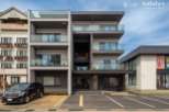 This stunning modern building boasts four floors of luxury apartments, each with its own private balcony.