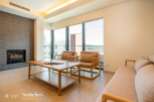 Modern living space with floor-to-ceiling windows offering stunning views.