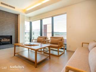 Modern living space with floor-to-ceiling windows offering stunning views.