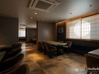 Sophisticated dining space featuring a sleek design and warm color palette.