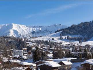 Nestled in a picturesque snow-covered village, this charming property offers breathtaking views of the majestic French Alps.