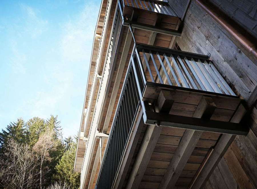 Discover the charm of this unique property, featuring stunning wooden balconies that offer a perfect blend of rustic and modern design.