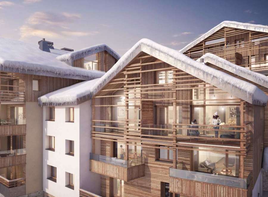 Discover the charm of this stunning ski chalet, boasting a unique wooden facade and snow-covered roofs.