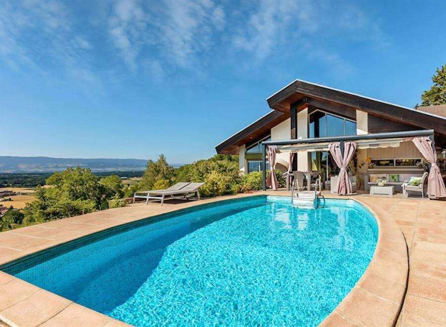 Luxury villa with stunning panoramic views and a private pool.