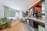 Luxurious bathroom with a large built-in bathtub and double vanity.