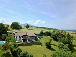 Luxury house nestled in the picturesque French countryside, boasting stunning views and a private pool.