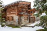 This stunning chalet boasts a unique blend of rustic charm and modern elegance.