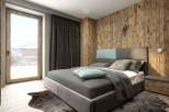 This cozy bedroom features a stunning wooden accent wall and a comfortable bed, creating a warm and inviting atmosphere.