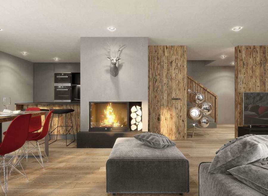 Experience luxury living in this stunning property, featuring a cozy fireplace and a modern kitchen.