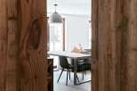 Discover the charm of this inviting dining space, framed by rustic wooden accents.