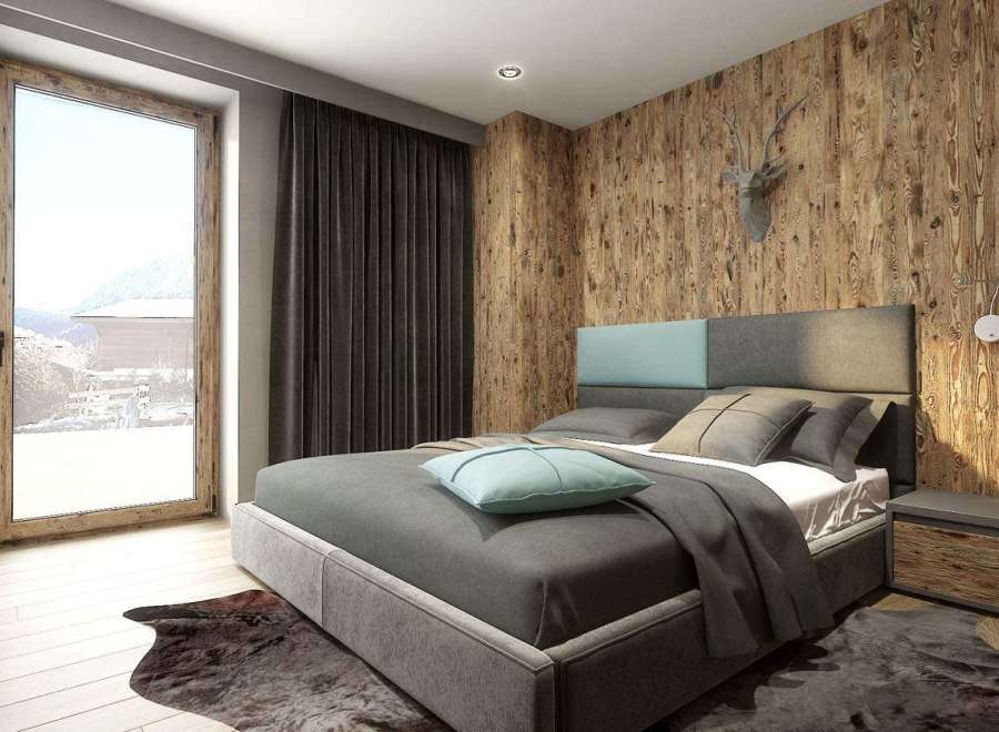 This cozy bedroom features a stunning wooden accent wall and a comfortable bed, creating a warm and inviting atmosphere.