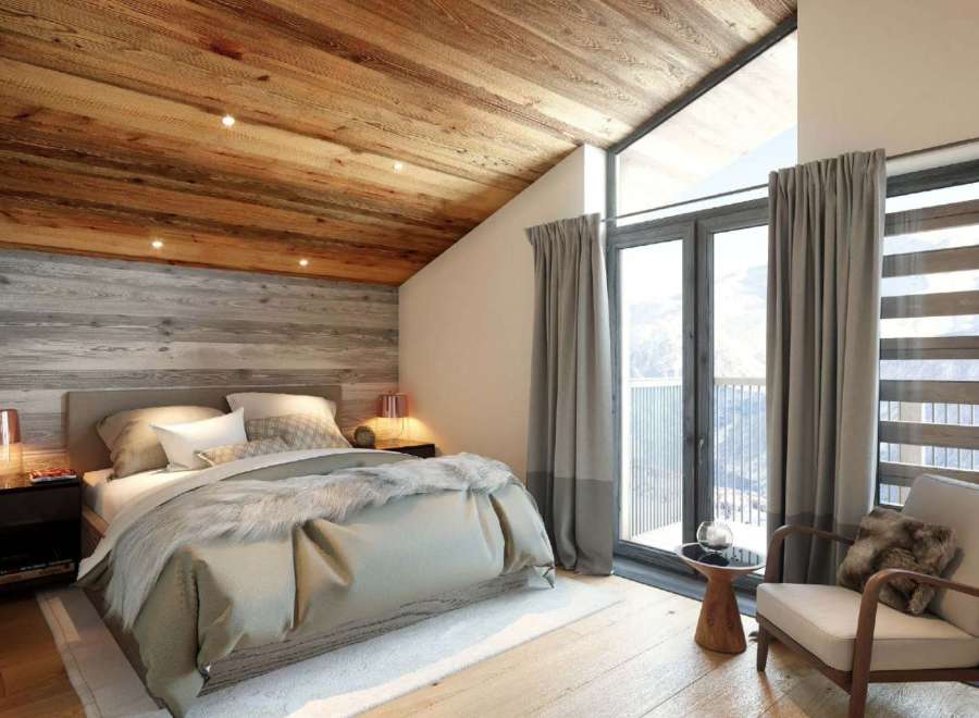 Luxury chalet bedroom with stunning mountain views.