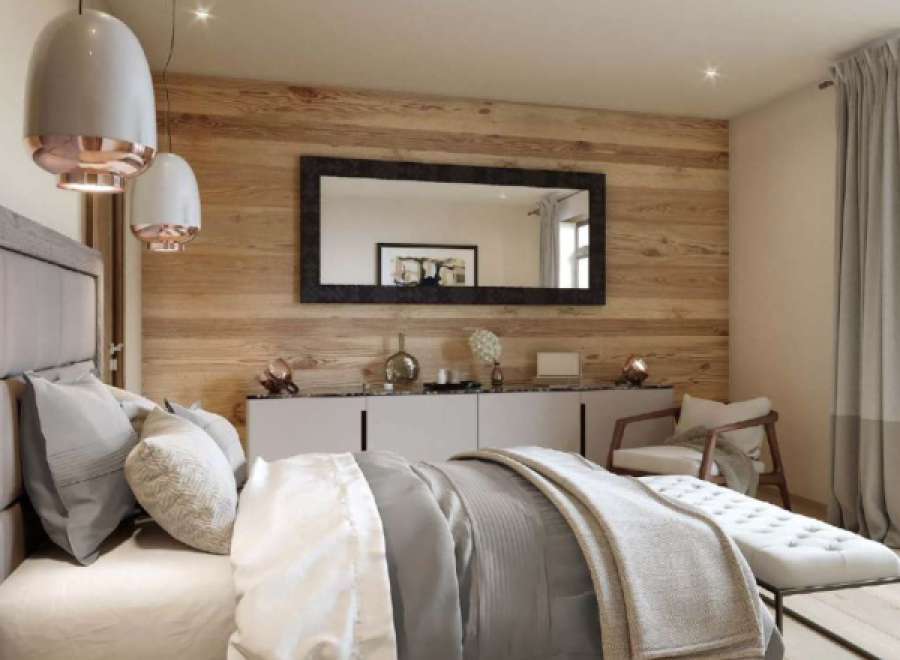 This stunning bedroom boasts a wood feature wall, creating a warm and inviting atmosphere.