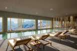 Indulge in luxury at this stunning property, featuring a serene indoor pool with breathtaking mountain views.