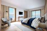 Experience luxury in this stunning bedroom with breathtaking mountain views.