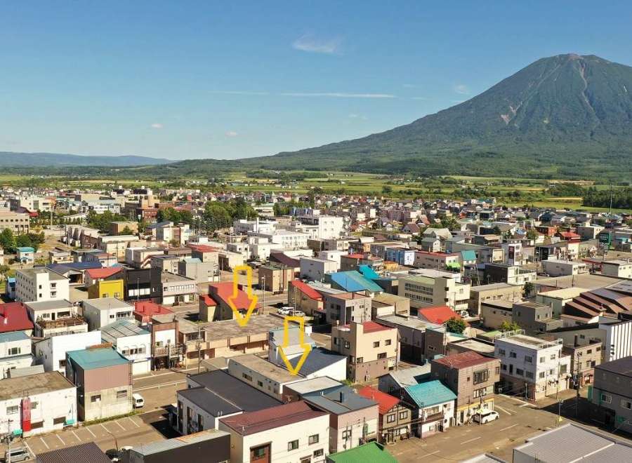 Discover a charming property nestled in a picturesque town, offering stunning views of a majestic mountain.